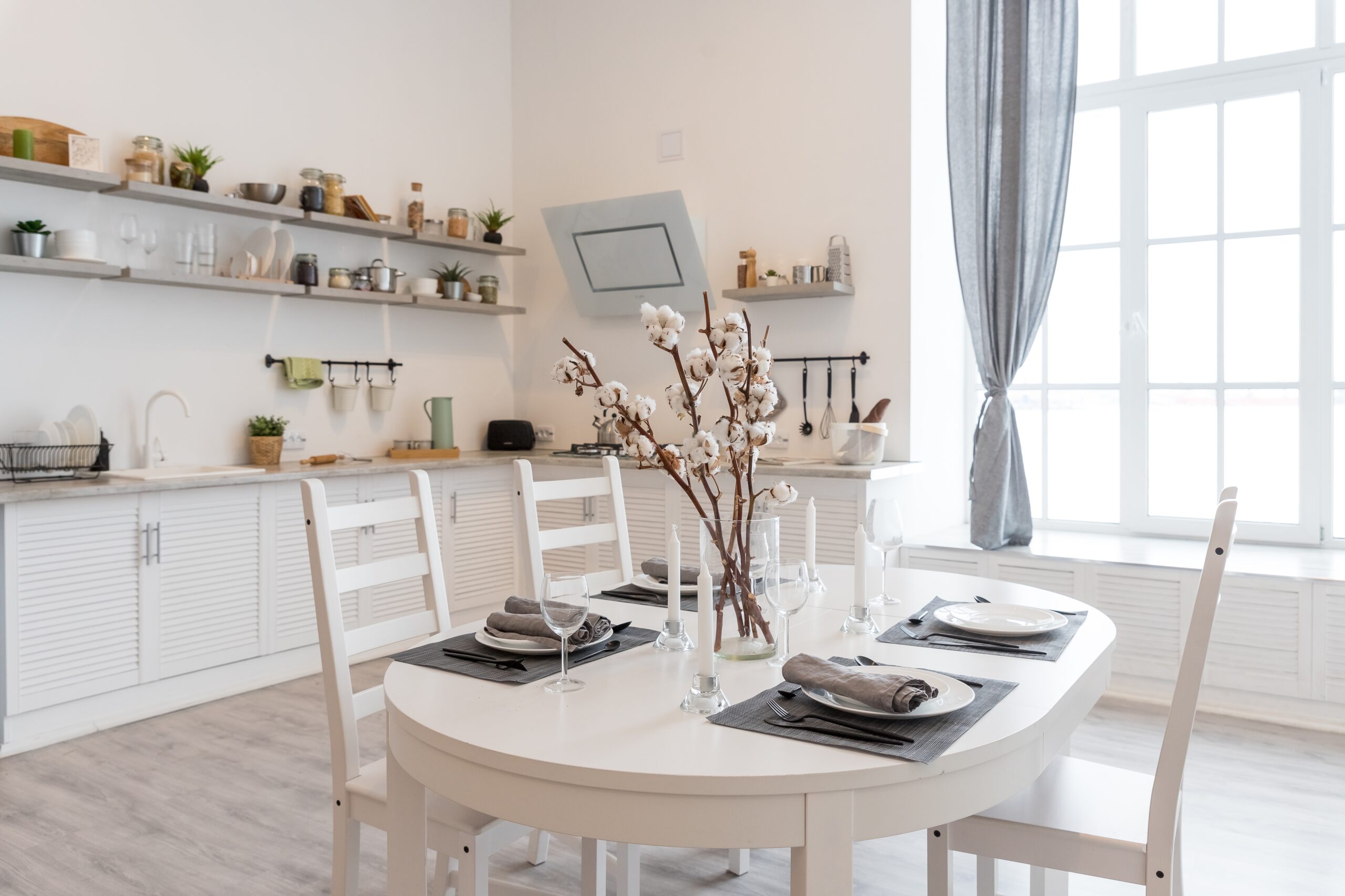 dining table with white plate setting in modern