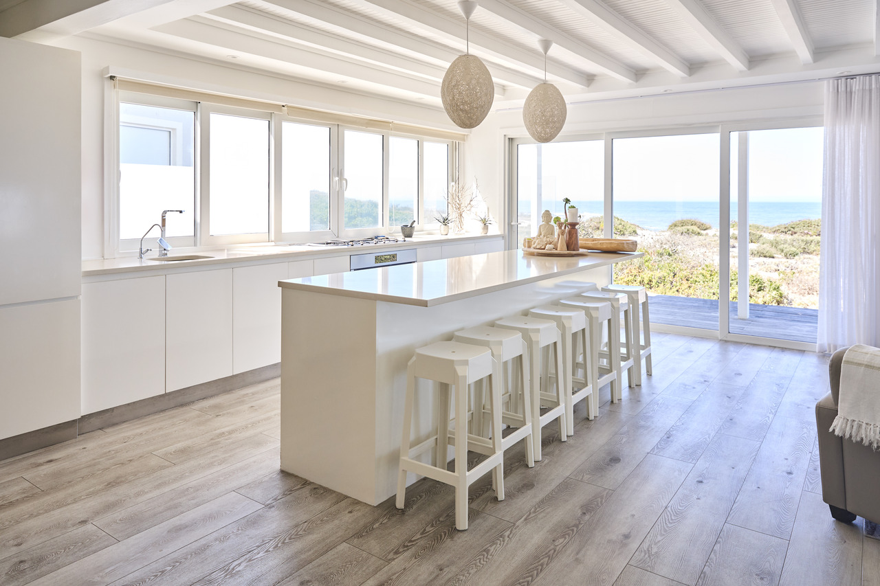 interior shot showing kitchen and counter in bea