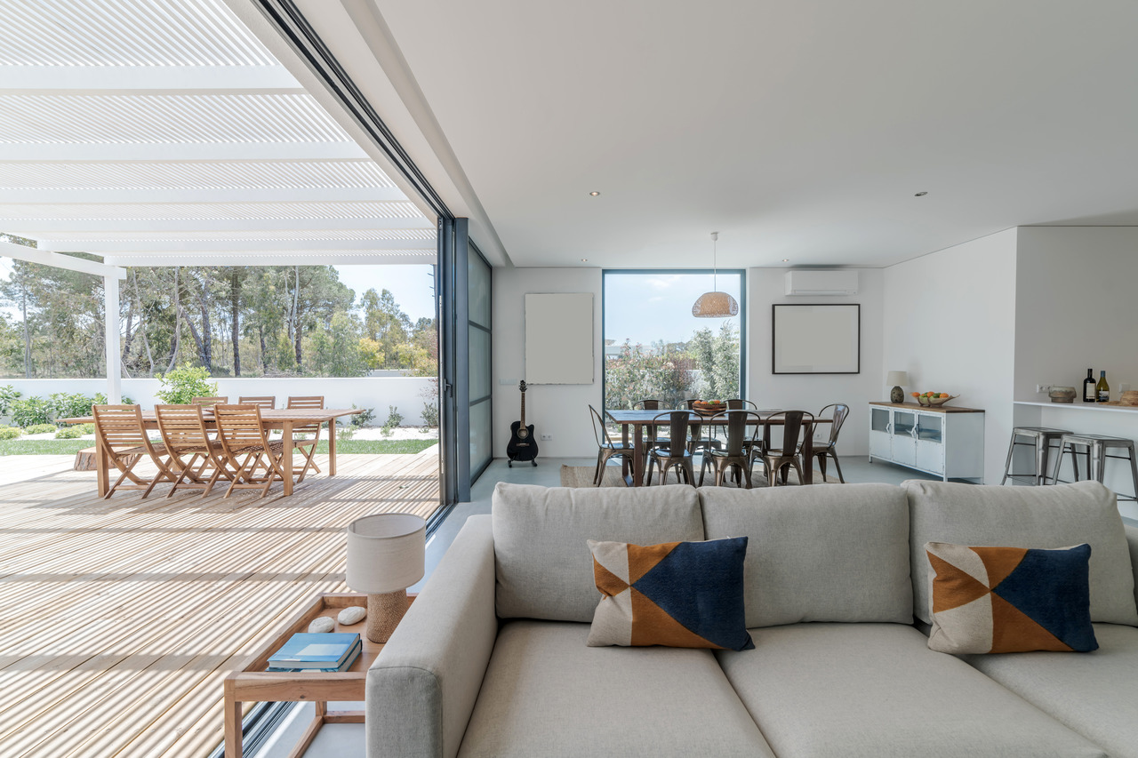 living room in modern villa with and deck outside