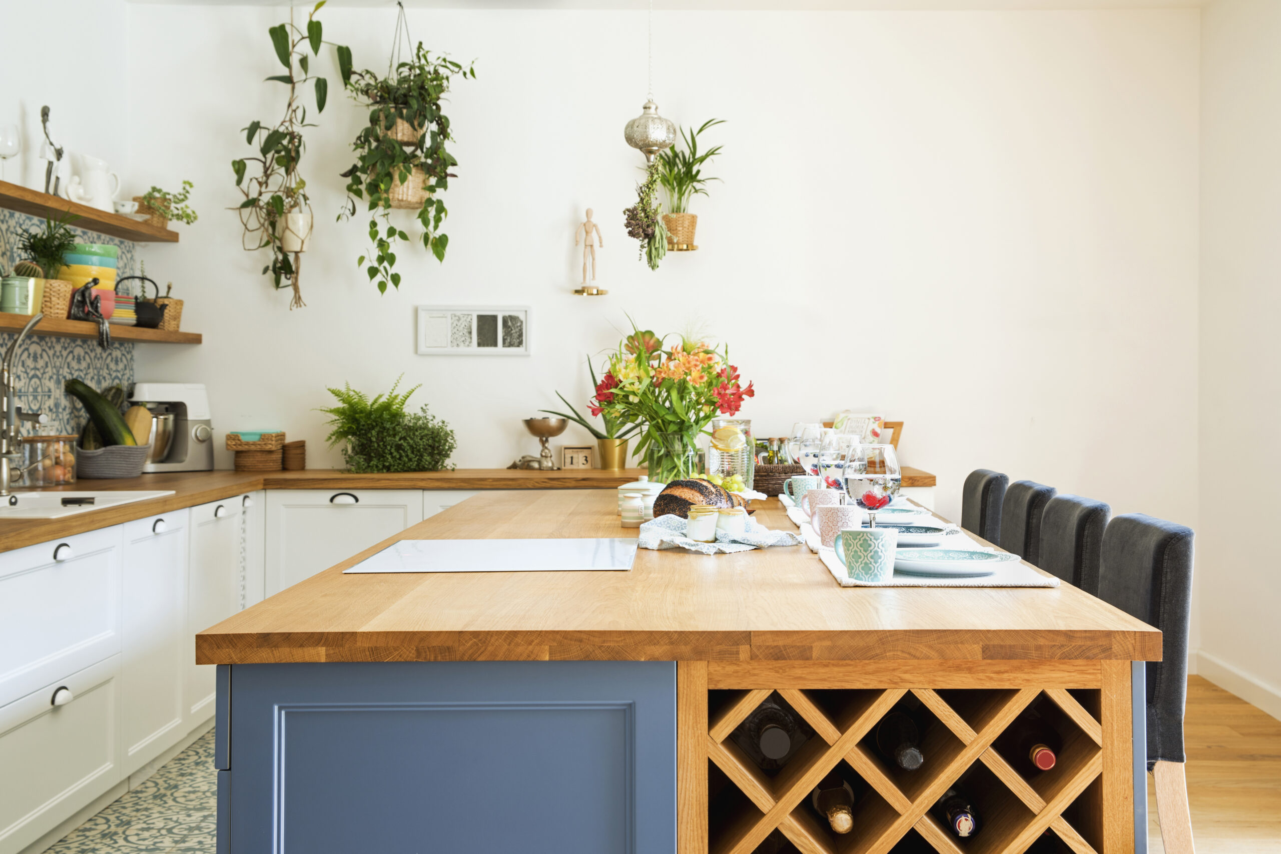 Stylish design of kitchen space interior with dining table, chai