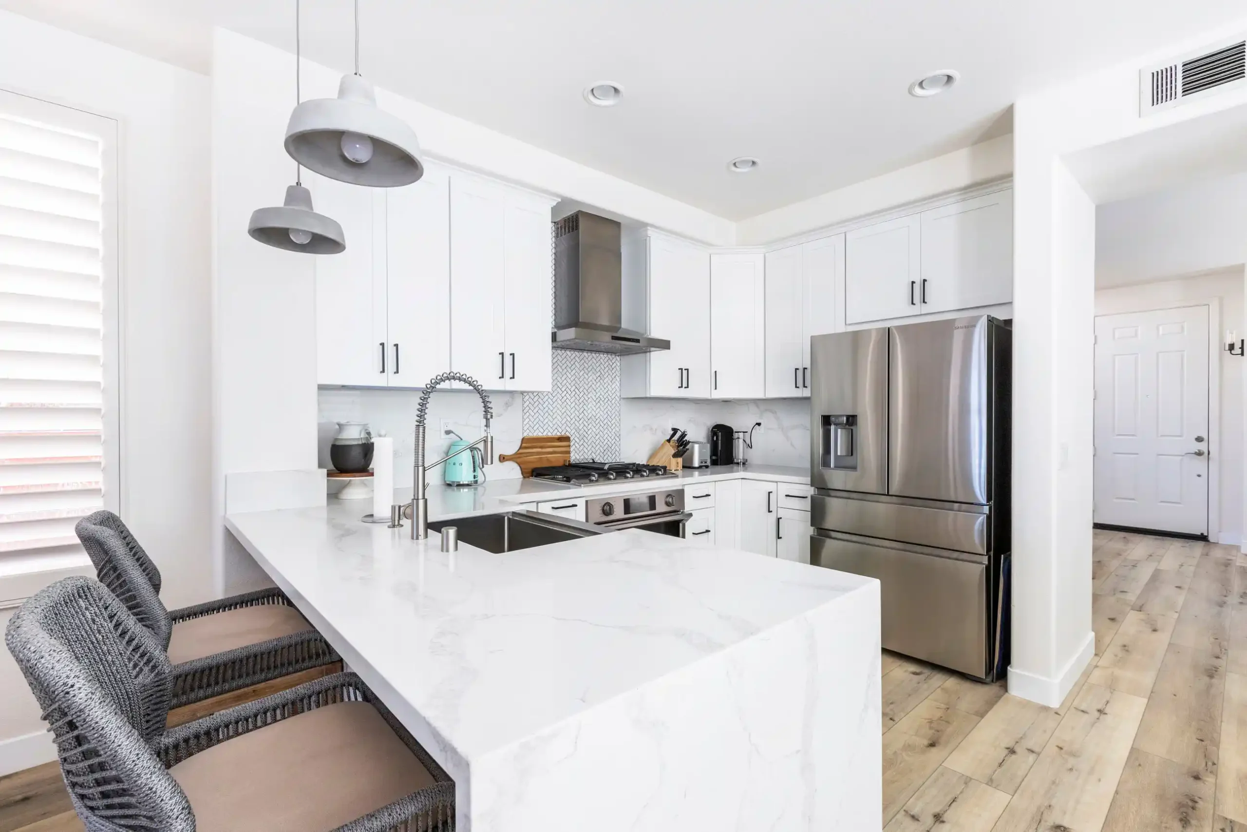 Kitchen Remodel Solana Beach — Waterfall Island & White Cabinetry