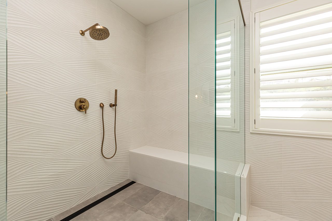 Master bathroom walk-in shower with wave tile