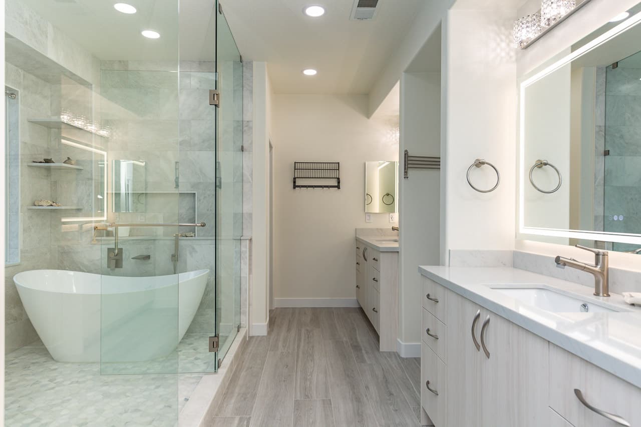 Master bathroom remodel wide view with vanity and glass shower Carlsbad