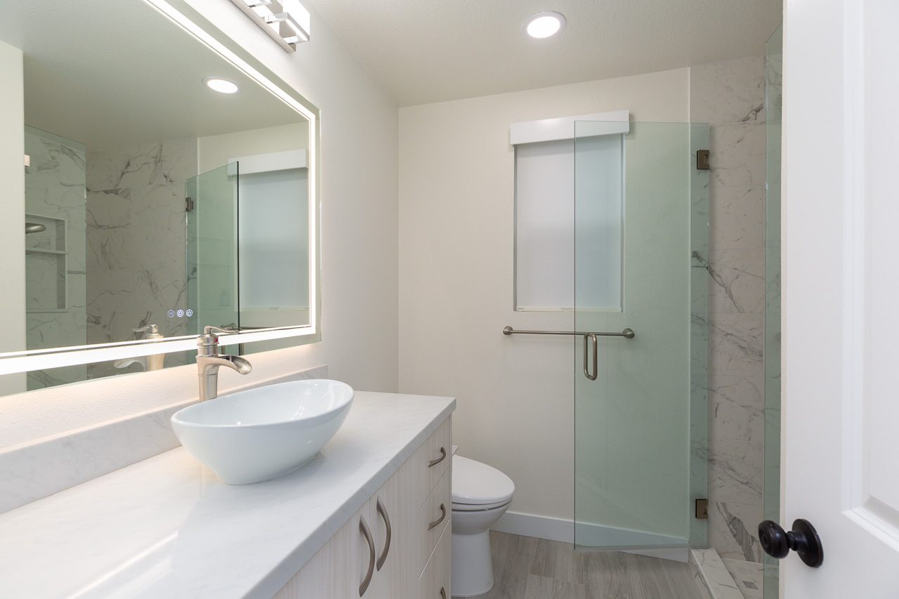 Guest bathroom after remodel Carlsbad CA with vessel sink and LED mirror