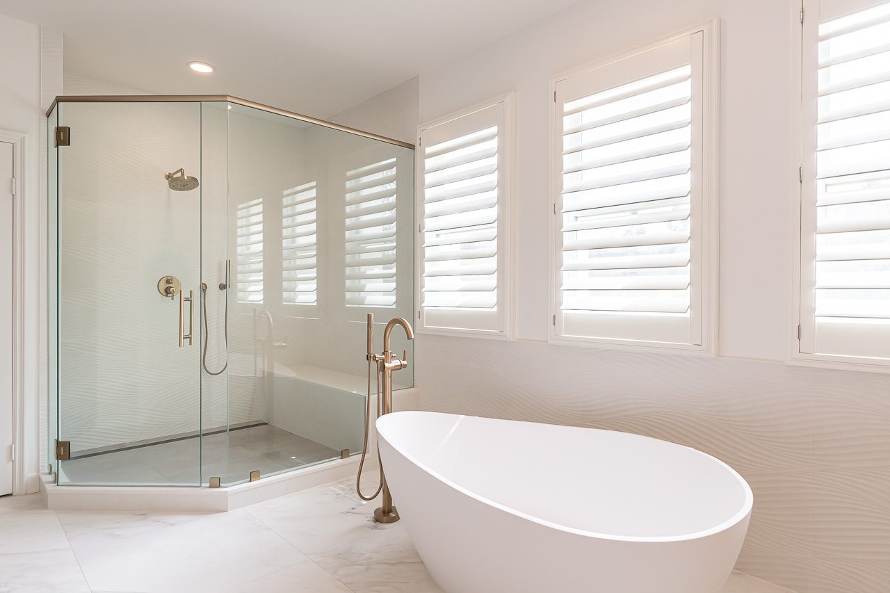 Modern San Diego bathroom with radiant heated tile floor, anti-fog LED smart mirror, layered dimmable lighting and a wall-hung smart toilet