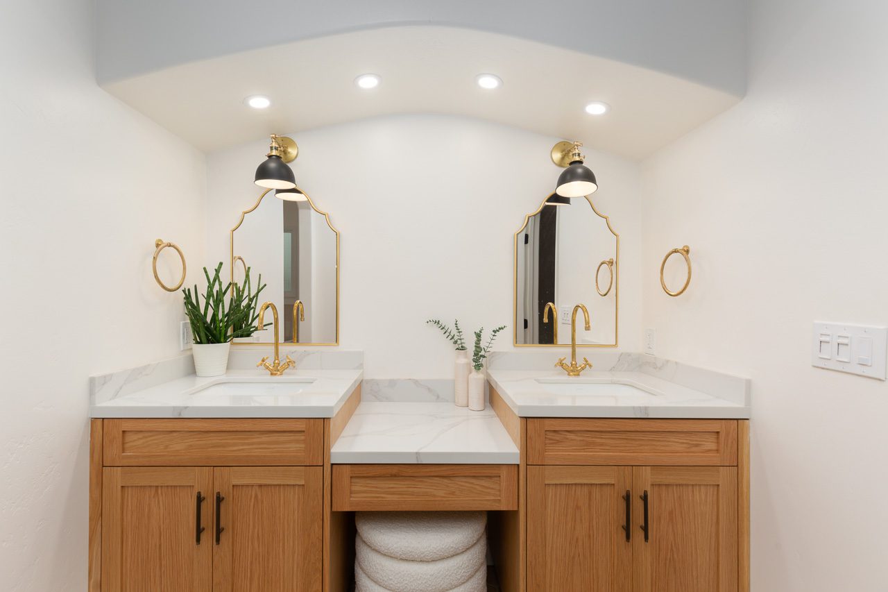 Custom oak double vanity with arch mirrors and sconce lighting, master bathroom remodel Mission Hills San Diego 92103