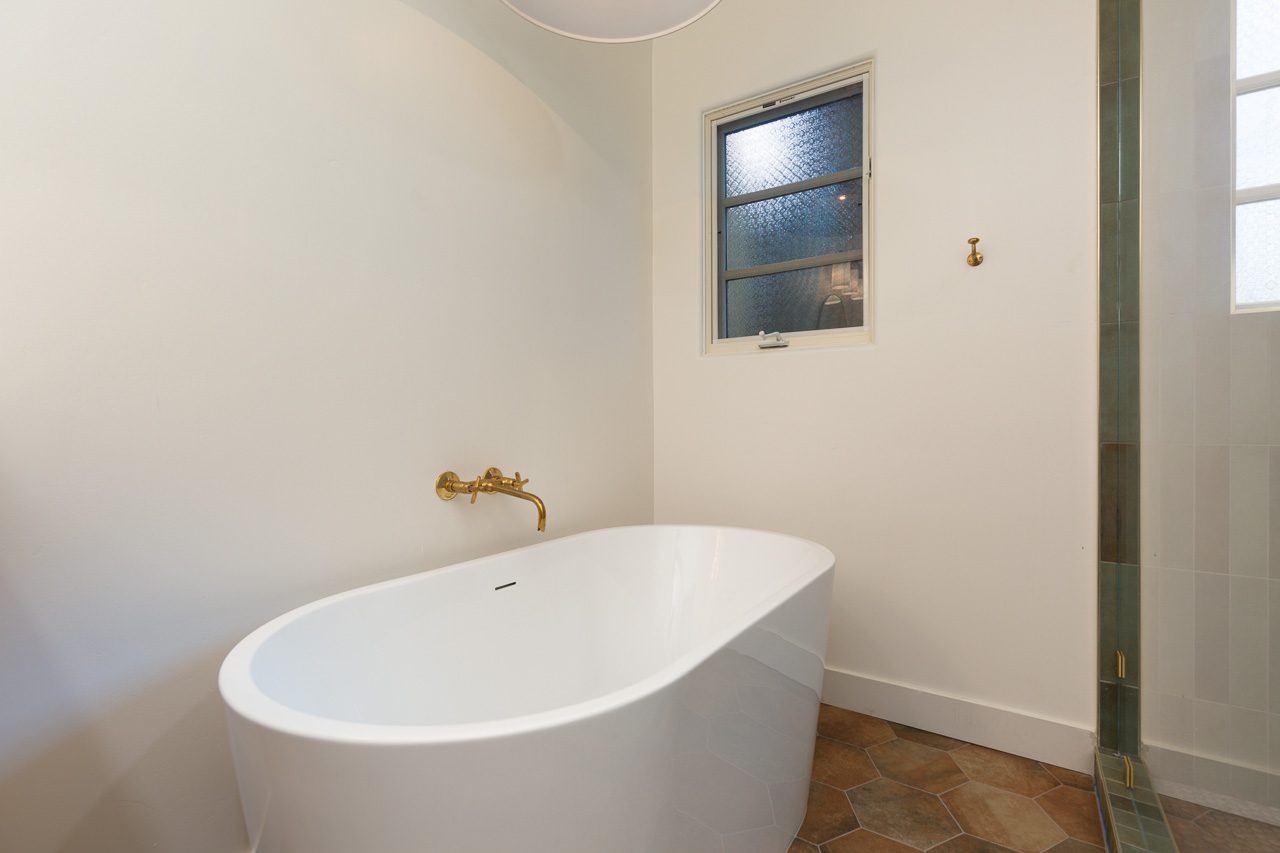 Green Zellige tile shower interior with hand-painted Talavera tile niches — Spanish Revival bathroom remodel Marston Hills Mission Hills San Diego