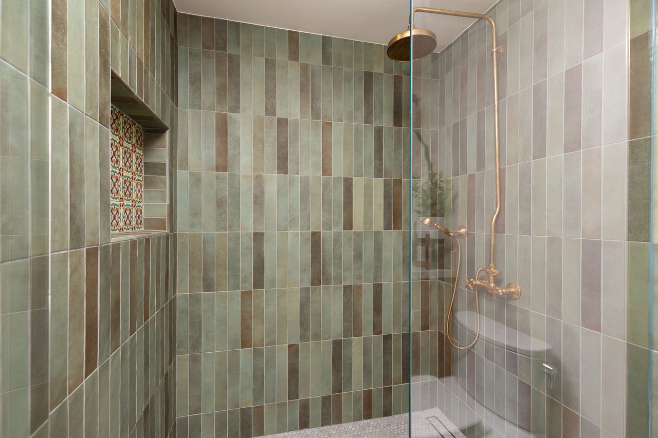 Green zellige tile walk-in shower with brass fixtures, bathroom remodel Mission Hills San Diego 92103