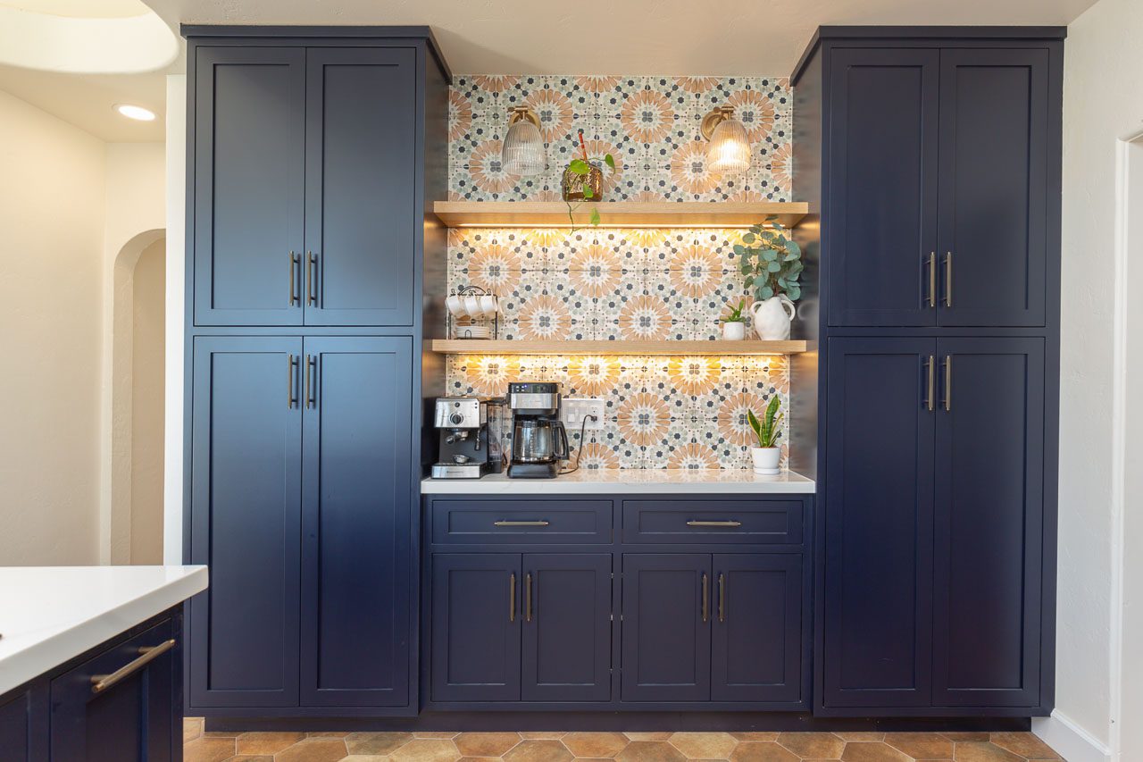 Spanish Revival kitchen side wall with oven tower, quartz countertop and bay window — Marston Hills historic home renovation San Diego 92103