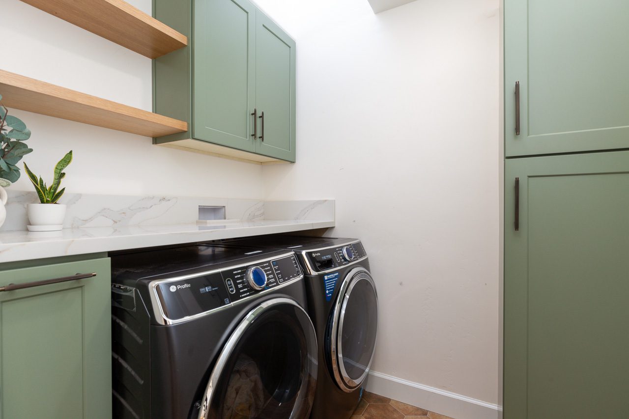 Laundry room remodel with sage green shaker cabinets and floating oak shelves, Mission Hills San Diego 92103