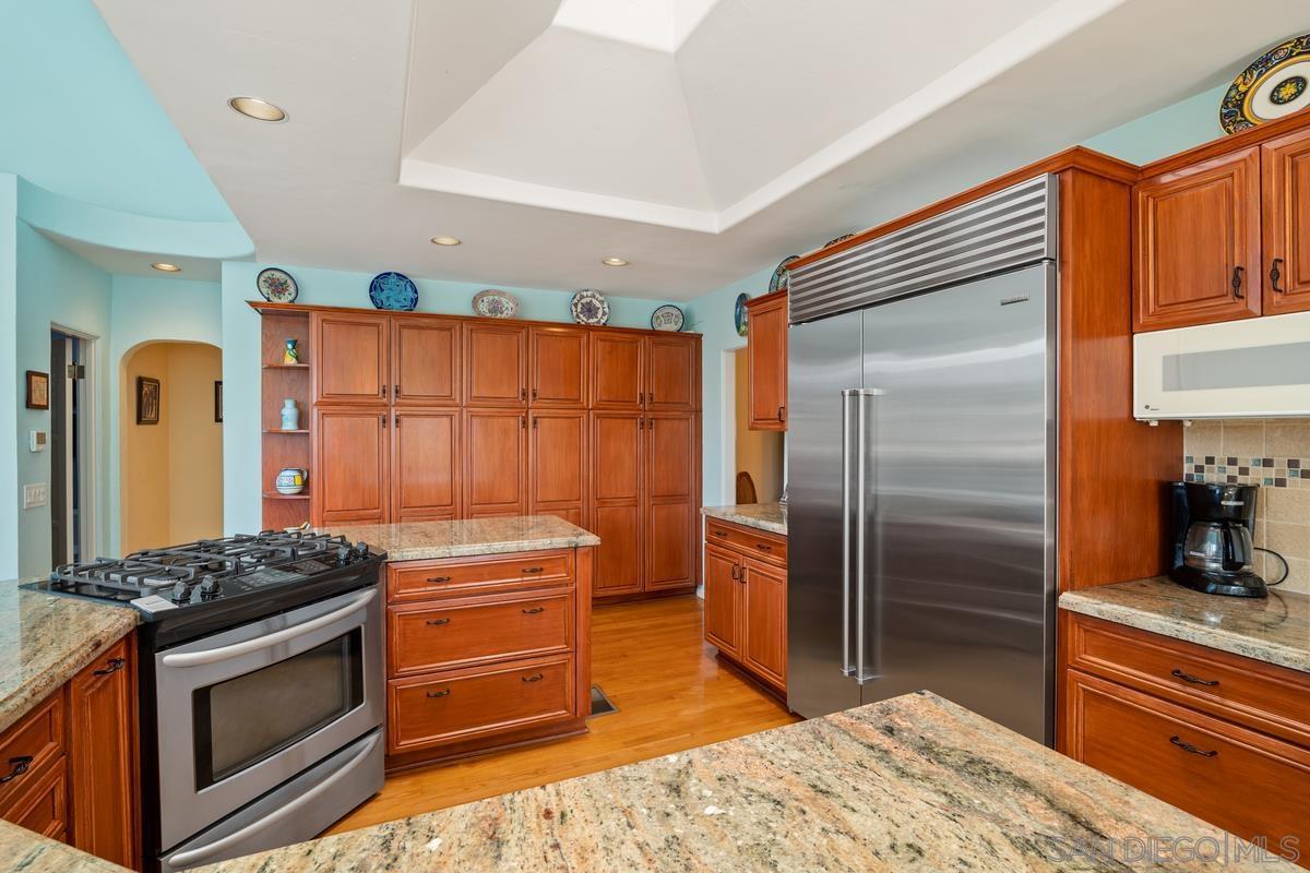 Kitchen island before remodel with granite countertop, Mission Hills San Diego
