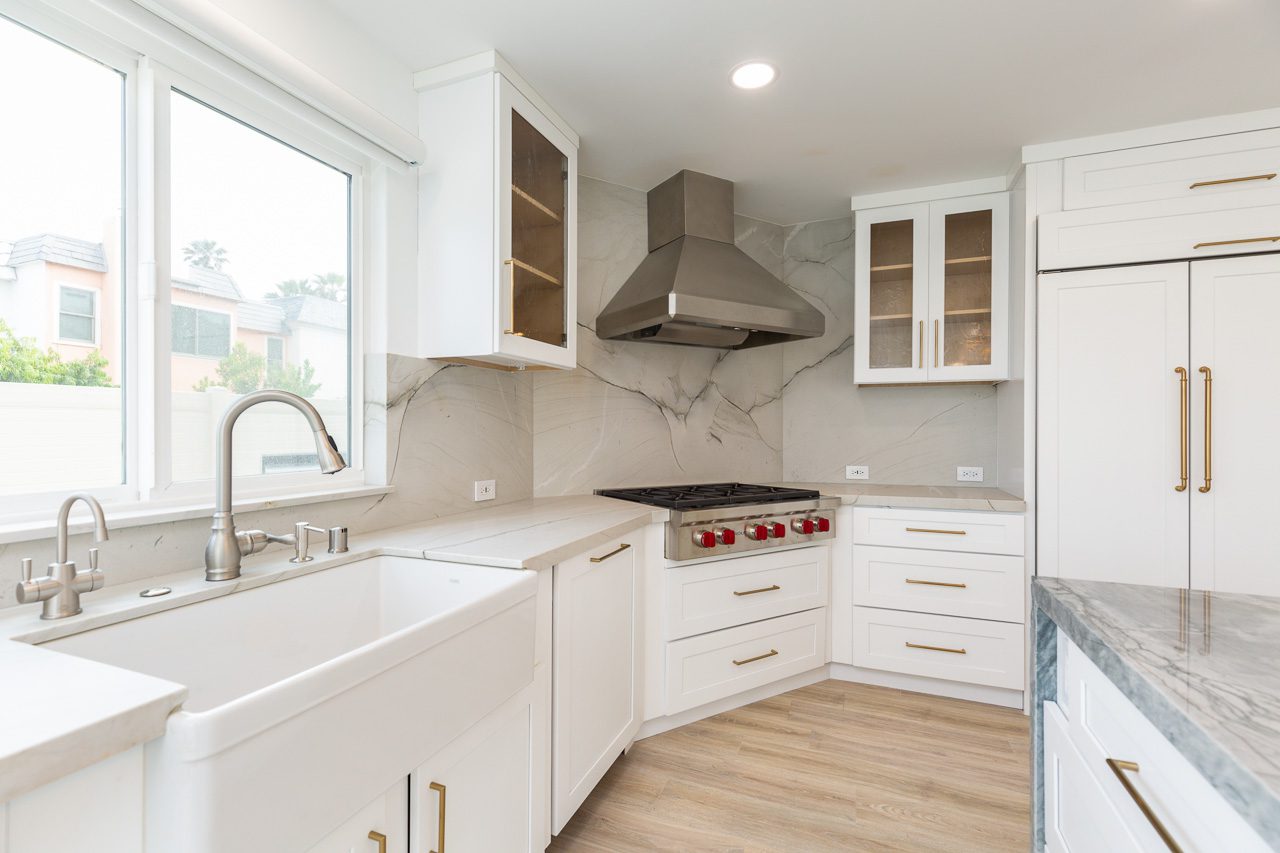 Quartzite slab backsplash Wolf range luxury kitchen remodel waterfront San Diego