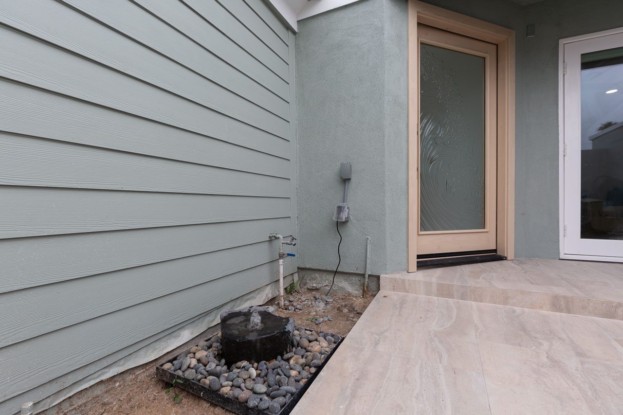 Front yard hardscape entry porcelain tile water fountain luxury outdoor remodel San Diego 92118