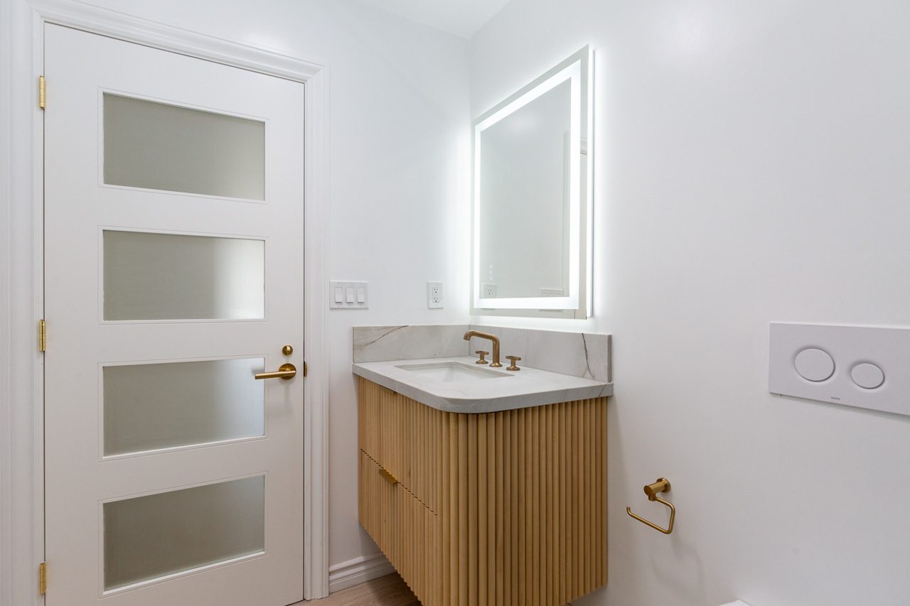 Custom guest bathroom fluted vanity LED mirror luxury remodel San Diego