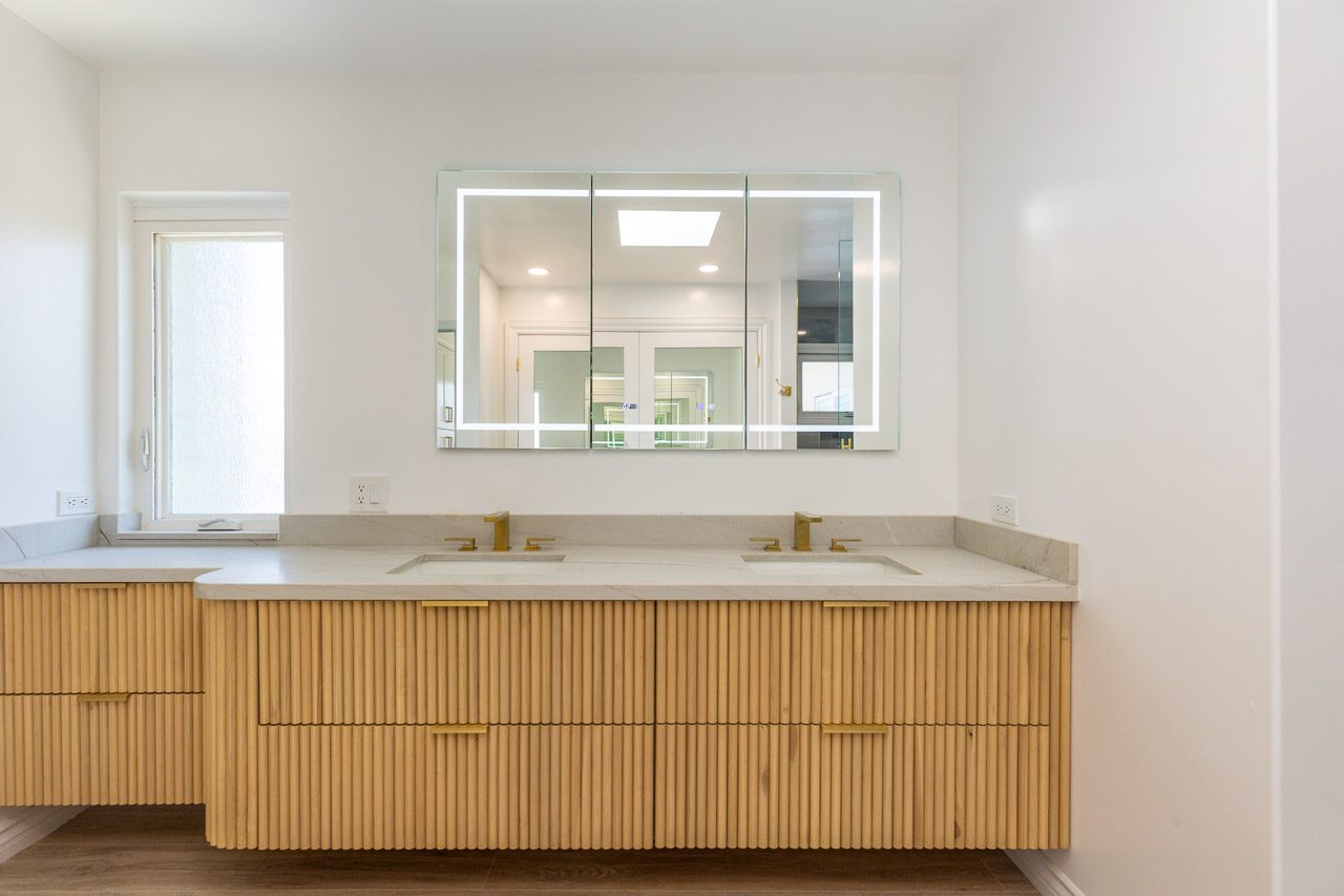 Master bathroom remodel San Diego — custom cabinetry with multiple storage solutions, drawers, mirror cabinet, integrated organization