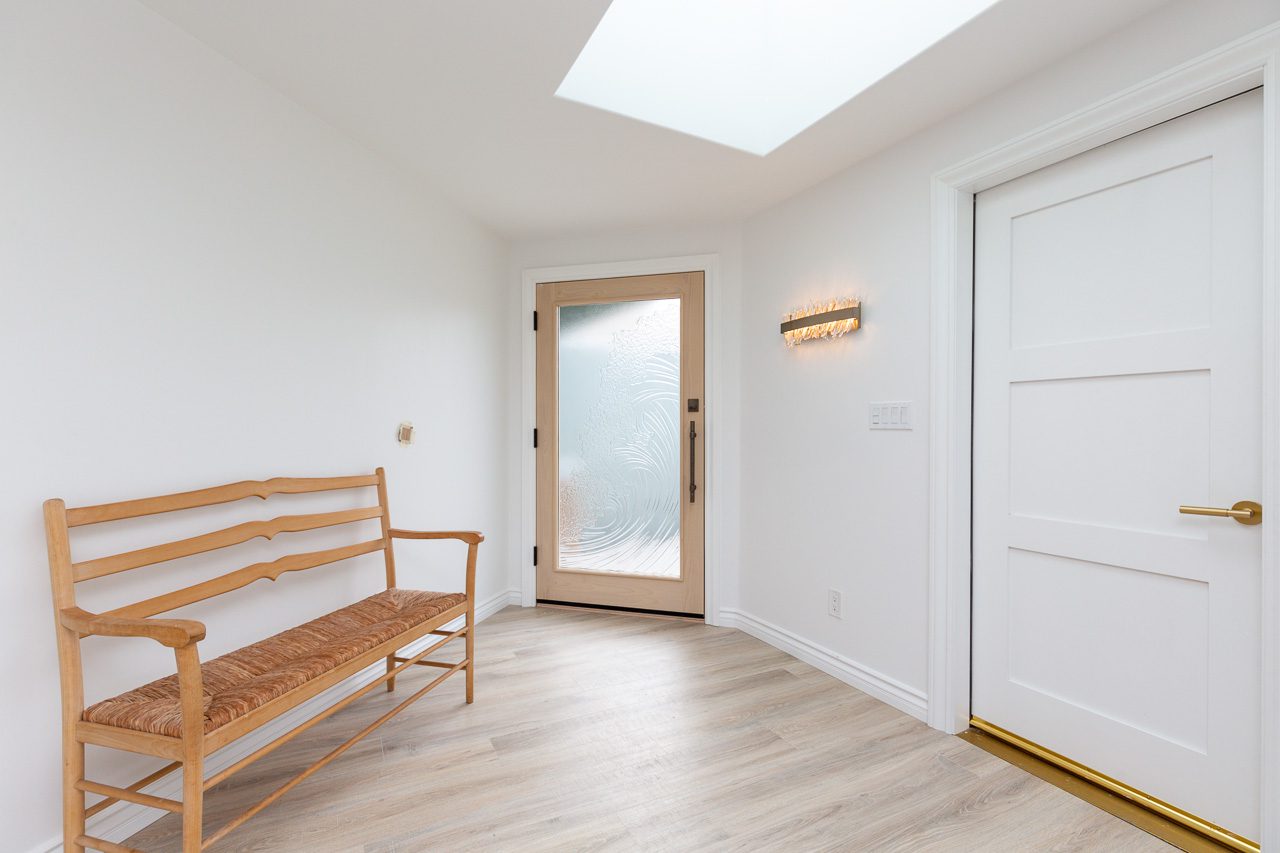 New entry door and skylight luxury home remodel waterfront San Diego 92118