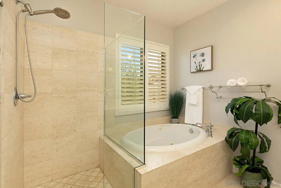 Master bath before remodel beige tile and built-in tub
